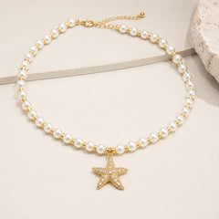Maxi Collar Perla con Dije Estrella de Mar Dorado Aura