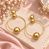 Aretes Triple Esfera Conexión Dorado - Bambú Rosa Joyas y Accesorios
