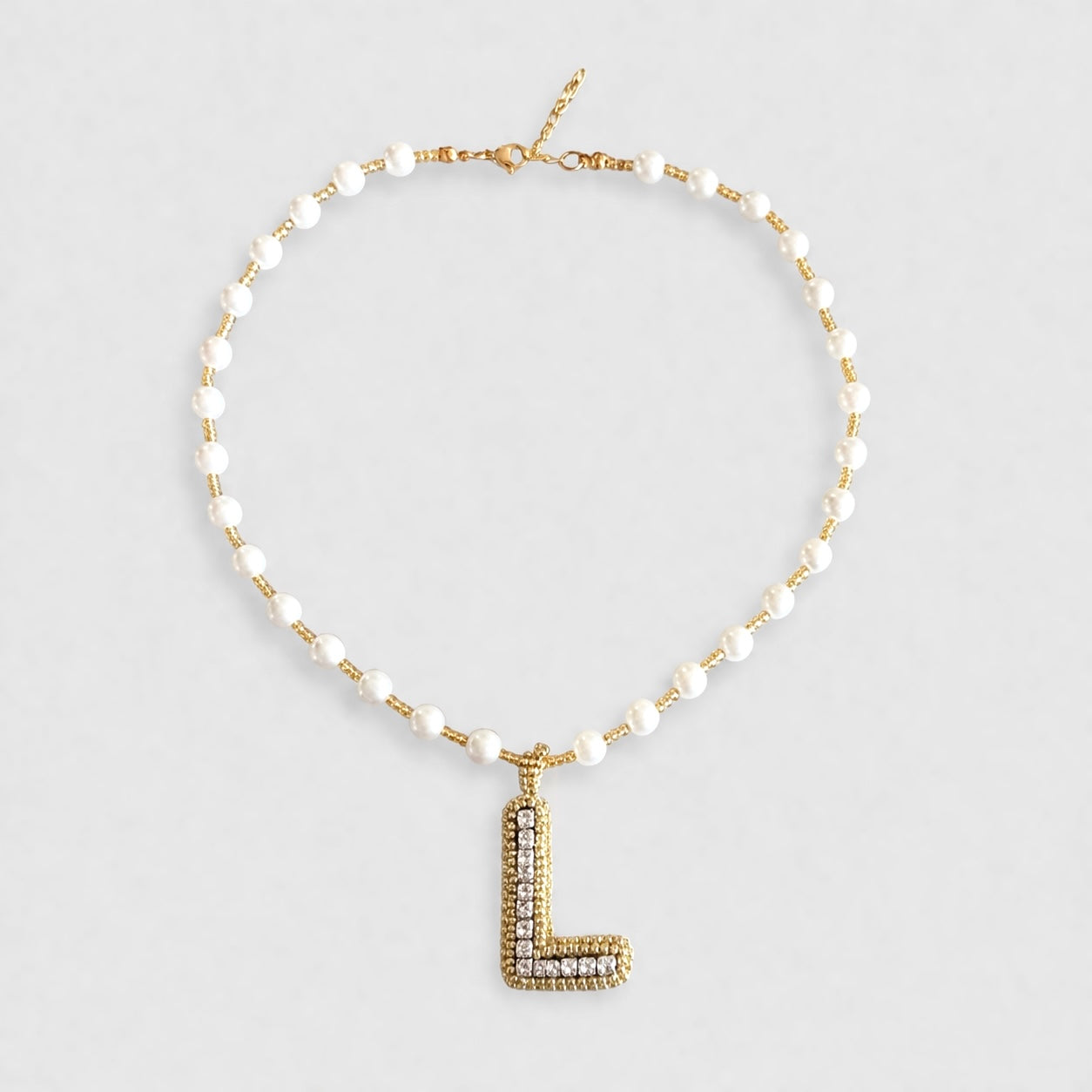 Collar Inicial tejida dorado - Bambú Rosa Joyas y Accesorios 