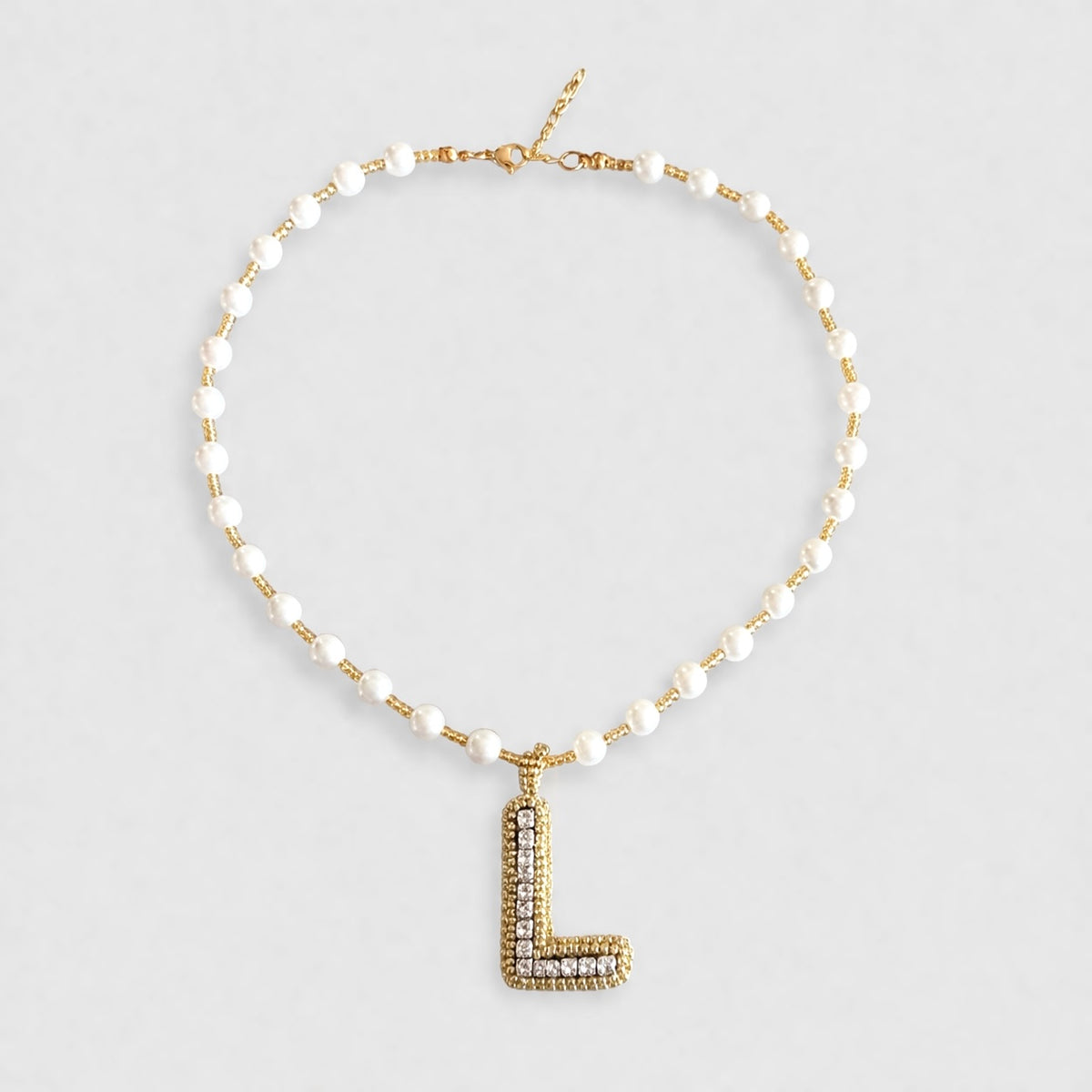 Collar Inicial tejida dorado - Bambú Rosa Joyas y Accesorios 