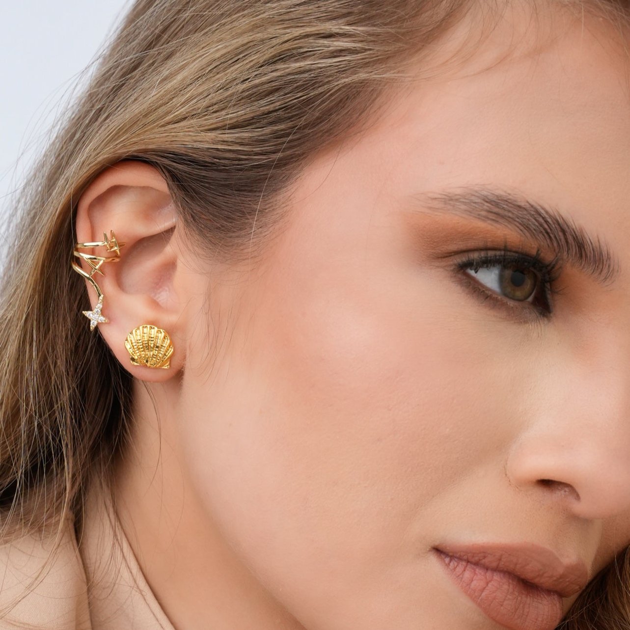 Ear Cuff Estrellas Visos Dorado