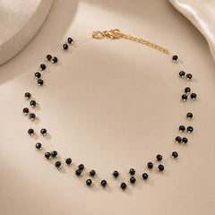 Collar Invisible Cristal Negro Entorchado Dorado Amaré