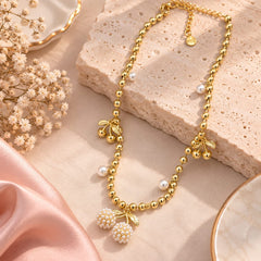 Collar Cerezas Doradas Con Perlas Latidos - Bambú Rosa Joyas y Accesorios 