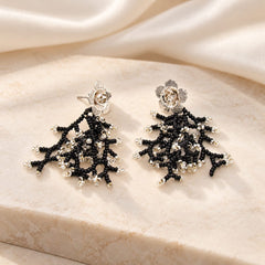 Aretes Flores Tejido Negro-Plata - Bambú Rosa Joyas y Accesorios 