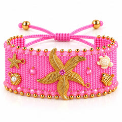 Pulsera Ancha Tejida Rosada Con dijes surtidos en Macrame Amore Dorado
